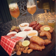 Non-Veg Platter - Crispy chicken wings in barbecue sauce, batter fried jumbo prawns, prawn popcorns and bacon wrapped sausages with 3 types of sauce @ Biere Street, Bangalore