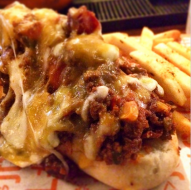 Over The Top (OTT) - Fried bacon wrapped sausage topped with melted cheese and minced meat @ Social Offline